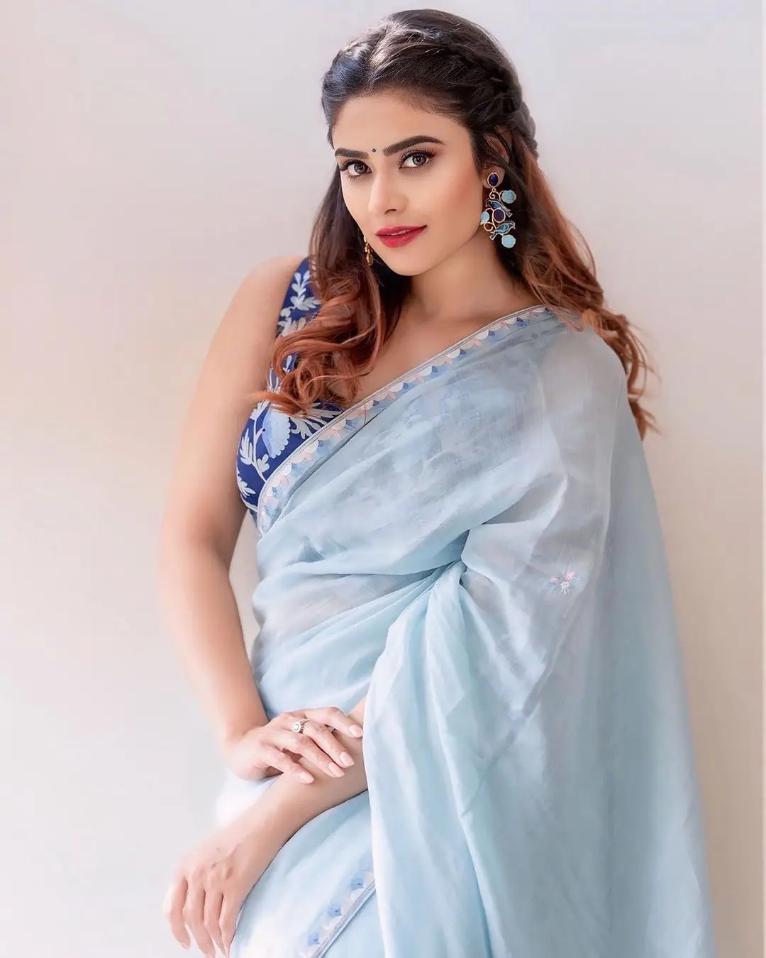 Priyanka Sharma Stills In Blue Saree Sleeveless Blouse